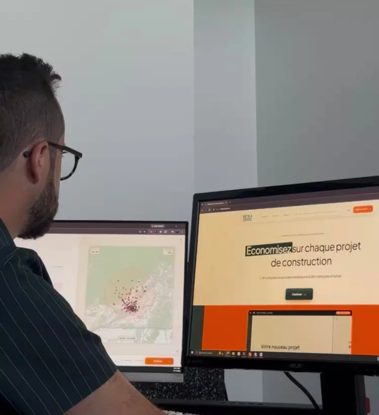 Simon Lafortune at a two screen desk with the app open next to a map of Quebec retailers